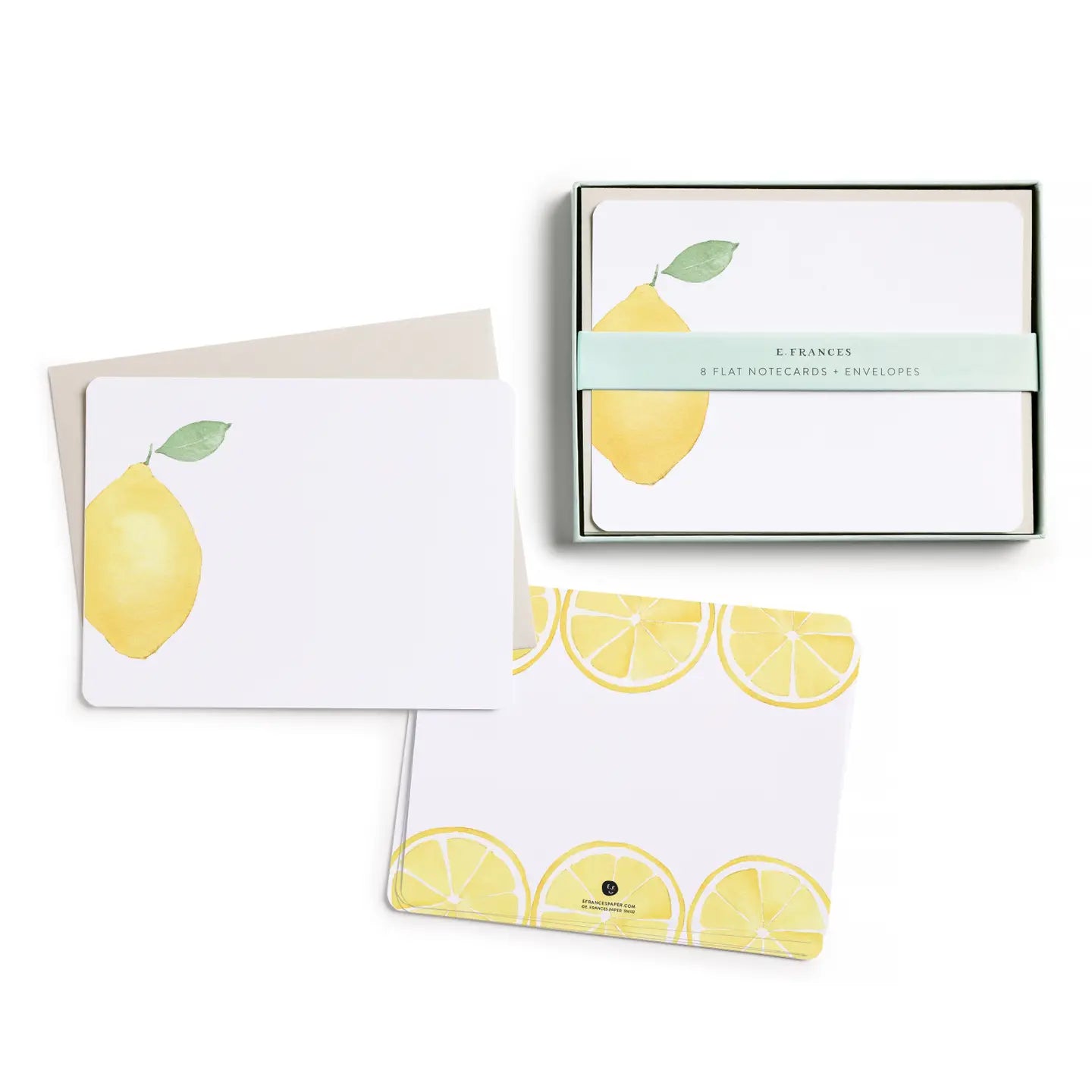Set of stationery items with lemon design on a white background