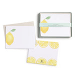 Set of stationery items with lemon design on a white background