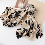 taupe fringe scarf with black floral printed design