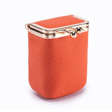 Orange textured jewelry box with gold clasp on a white background