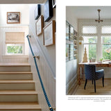 Staircase with a railing and a home office with a desk and chair.