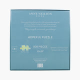 Box of Anne Neilson Home Hopeful Puzzle with puzzle piece illustration