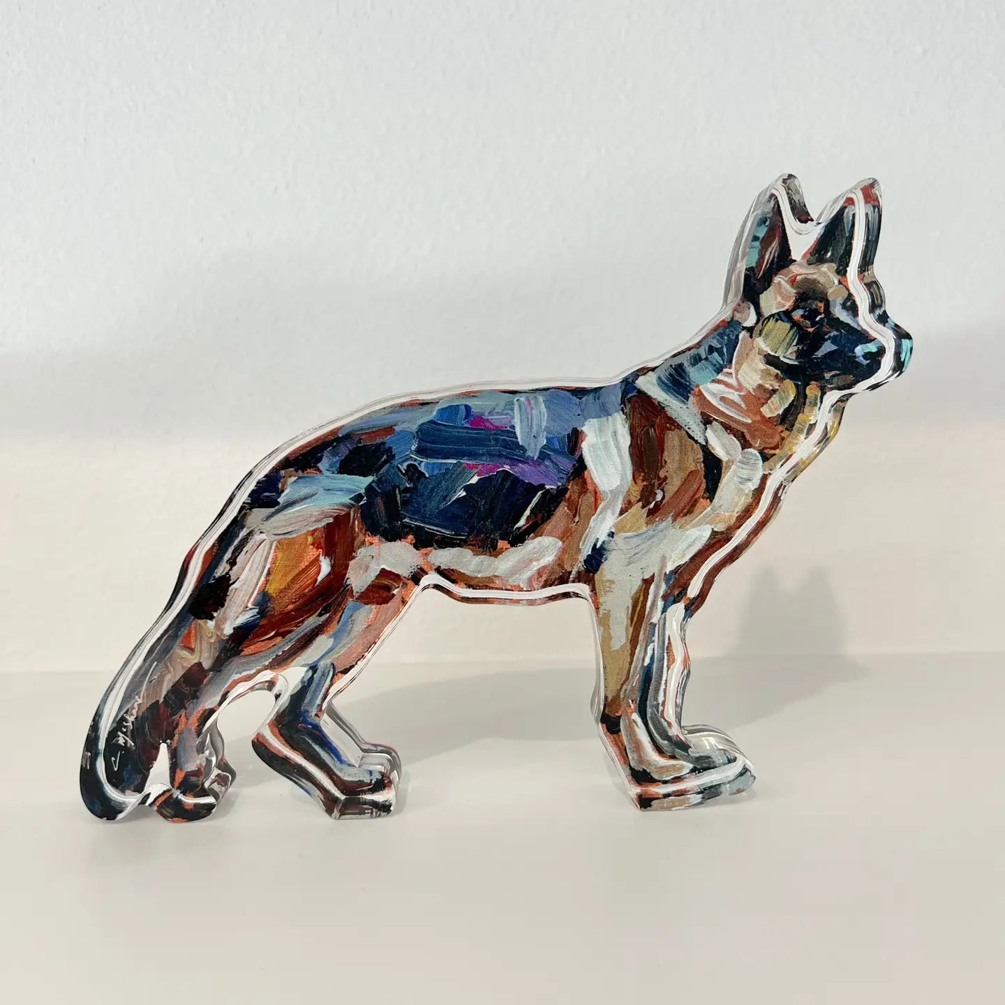 german shepherd dog shelfie featuring painted artwork encased in a thick clear freestanding block on white background