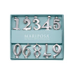 Set of silver numbers in a teal box with 'Mariposa' branding.