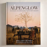 Book titled 'Alpenglow' by Hillary Munro with a cover featuring a scenic outdoor scene.