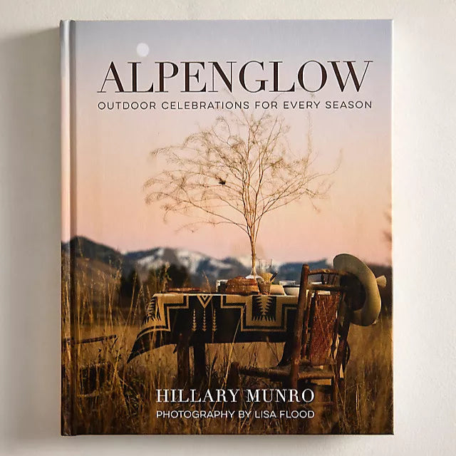 Book titled 'Alpenglow' by Hillary Munro with a cover featuring a scenic outdoor scene.