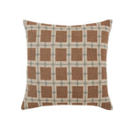 Decorative pillow with brown square pattern on a beige background