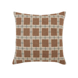 Decorative pillow with brown square pattern on a beige background