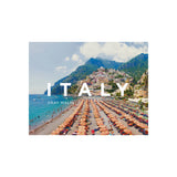 Book cover of 'Italy' by Gray Malin featuring a beach scene with umbrellas and mountains.