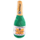 plush dog toy shaped like a champagne bottle saying "woof clicquot"
