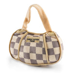 Plush Checker Chewy Vuiton Handbag dog toy in beige and cream check pattern with embroidered “Chewy Vuiton Paris” label and squeaker inside.