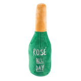 plush dog toy shaped like a champagne bottle saying "rose all day"