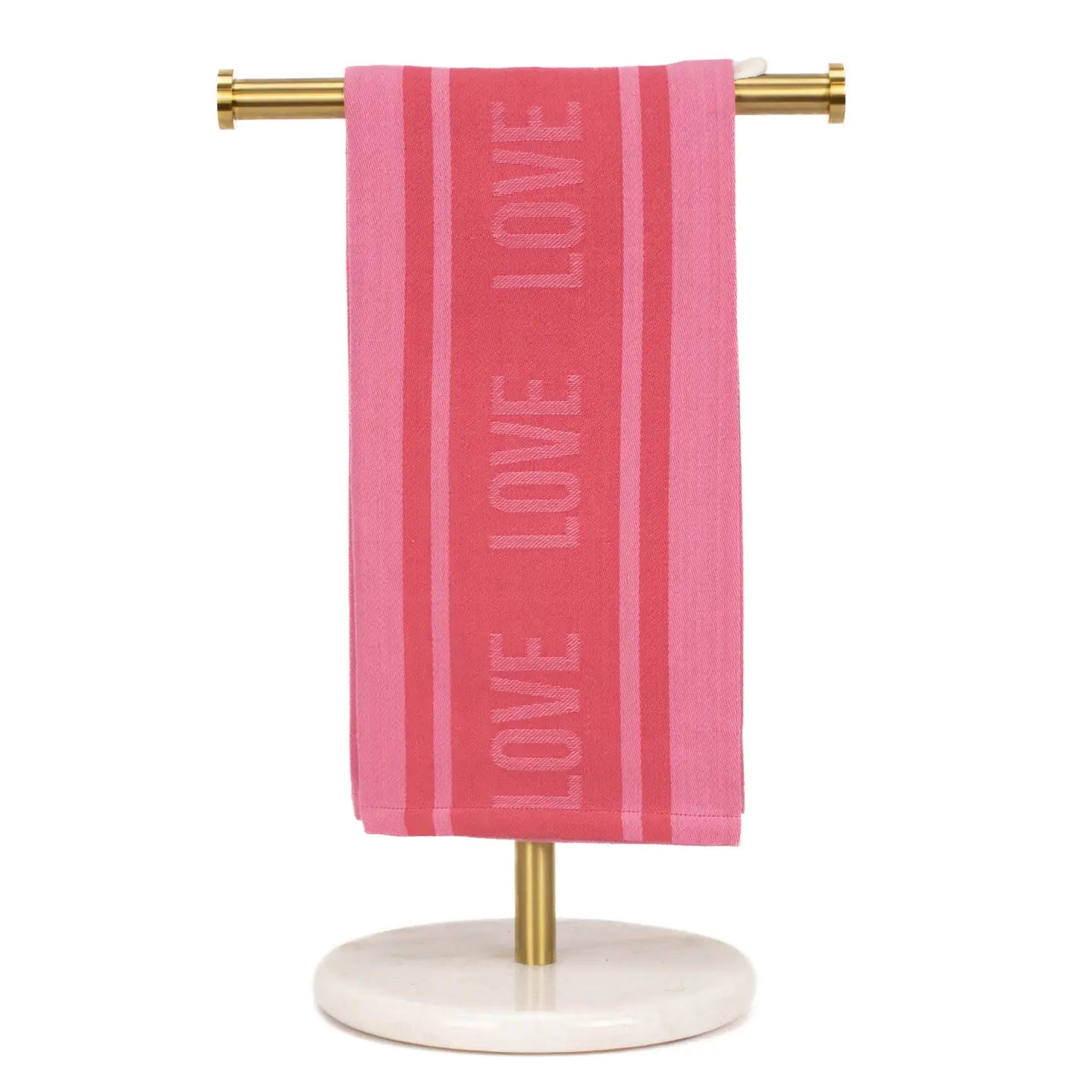Pink towel with 'LOVE' text on a gold towel rack against a white background