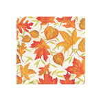 A square paper napkin featuring a repeating pattern of autumn maple leaves in shades of orange, red, and yellow on a white background.