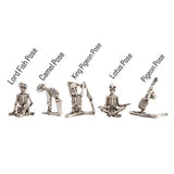 small resin skeletons in yoga positions, five styles