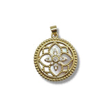 Gold pendant with floral design on a white background