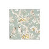 Patterned paper cocktail napkins with birds and floral design on a light blue background