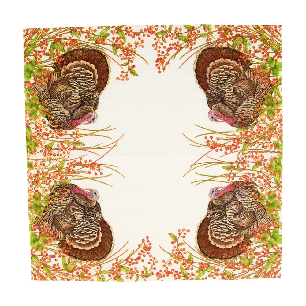 Patterned paper napkin with turkeys and foliage on a white background