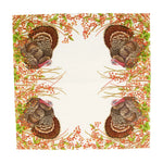 Patterned paper napkin with turkeys and foliage on a white background
