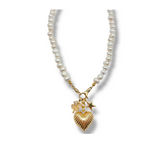 Pearl necklace with gold heart and star charms on a white background