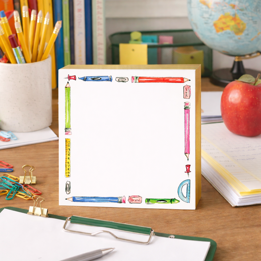 Notebook with pencil design on a desk with stationery items