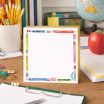 Notebook with pencil design on a desk with stationery items