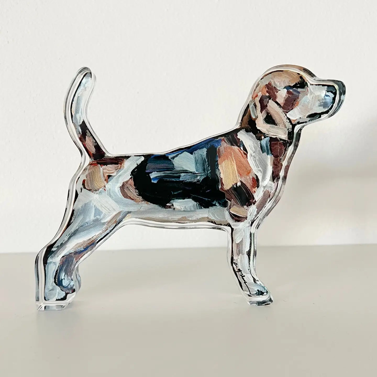 acrylic beagle figurine on a white background