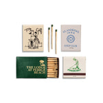 Collection of matchboxes with golf-themed designs on a white background