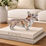 Decorative corgi acrylic figurine on a stack of books with a homey background