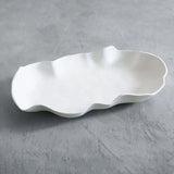 beatriz ball vida nube large platter on gray concrete surface