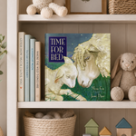 Children's book titled 'Time for Bed' on a shelf with toys and books.