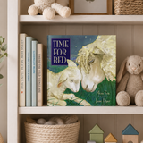 Children's book titled 'Time for Bed' on a shelf with toys and books.