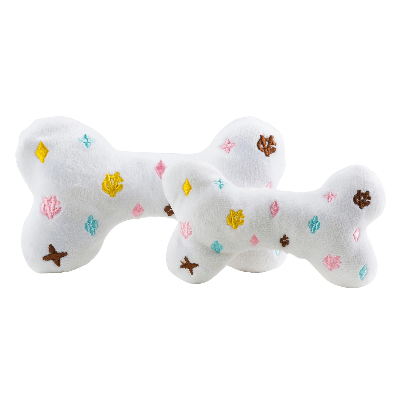 white plush dog toys designed to resemble handbags with 'CHEWY VUITON' embroidered on the surface.