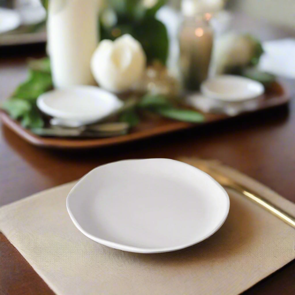 White plate on a wooden table with a blurred background 