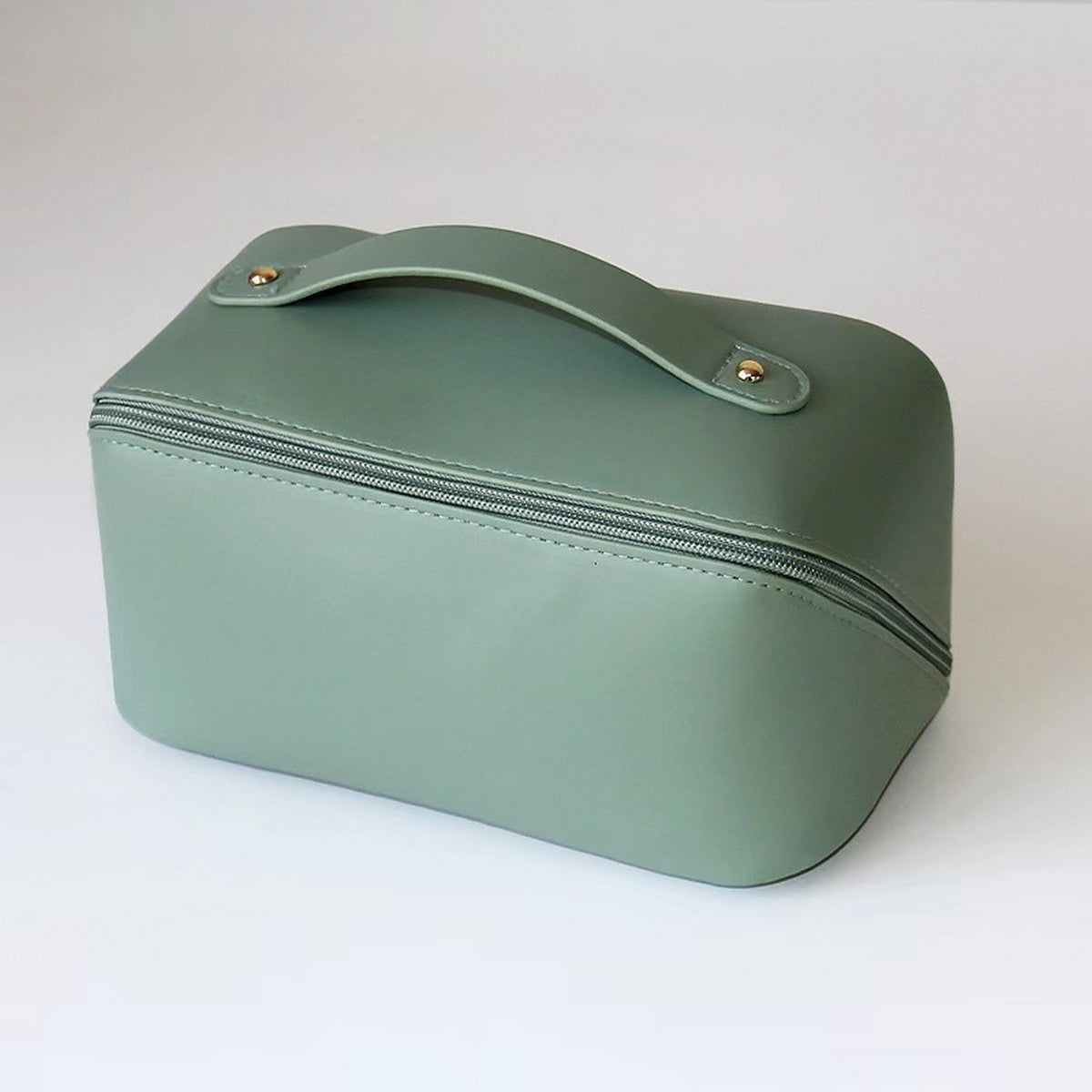 Green travel case with a handle on a white background