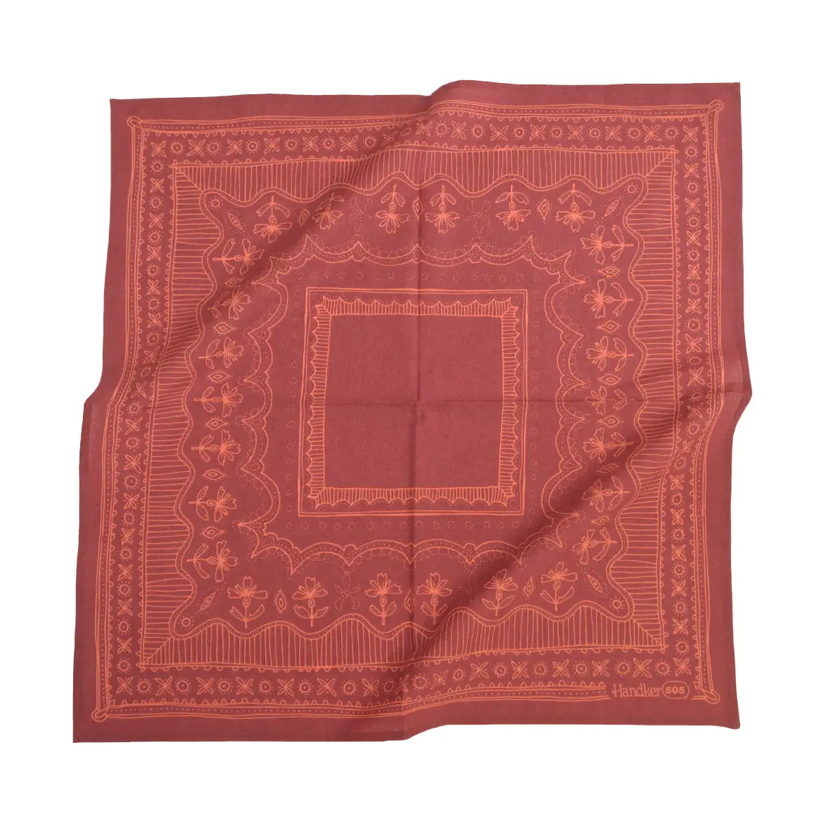 Red bandana with intricate patterns on a white background