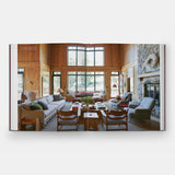 Modern living room with wooden floors, large windows, and a fireplace.