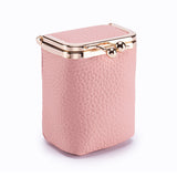 Pink jewelry box with gold clasp on a white background