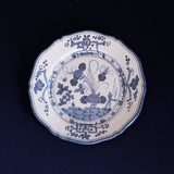 beatriz ball vida faenza 11" dinner plate with floral and landscape design on a black background