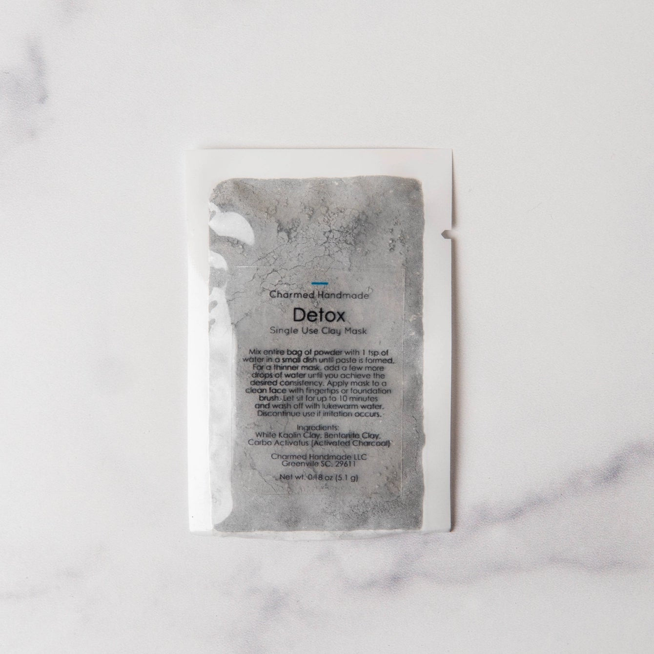 Detox product packaging on a marble surface