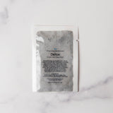 Detox product packaging on a marble surface