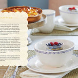 Tea set with a pie and flowers on a table, with text overlay.