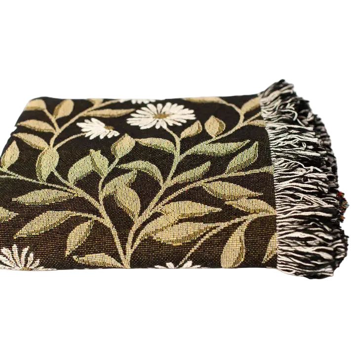 Floral patterned throw blanket with fringes on a white background