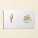 Book with illustrations of ice cream and cake on a beige background
