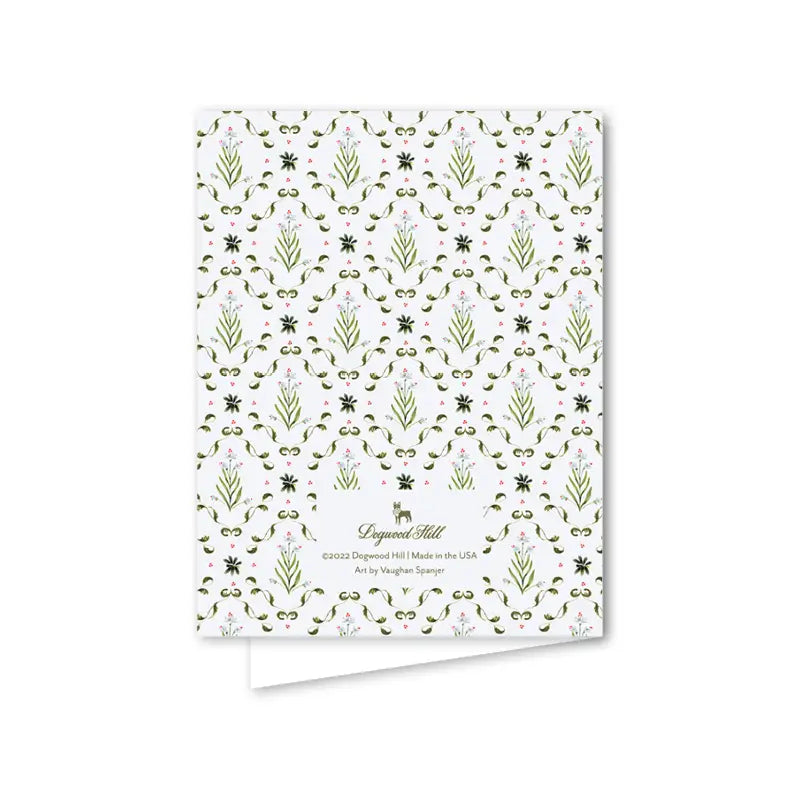 Patterned card with green and pink design on a white background