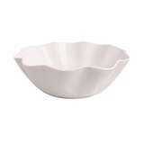White enamel bowl with a wavy edge on a white background