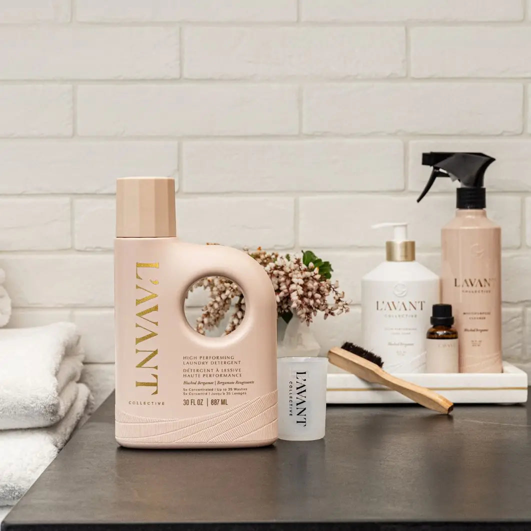 LAVANT laundry detergent bottle on a counter with other products against a tiled wall background