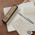 6-In-1 Multi Tool Pen in Gift Box shown with papers