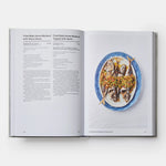 Open cookbook showing a plate of food with a recipe on a white background