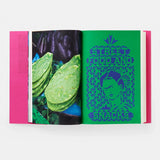 Open book with green pages showing tortilla chips and a colorful cover on a white background
